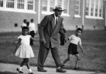 Father escorting children to school in Prince Edward County